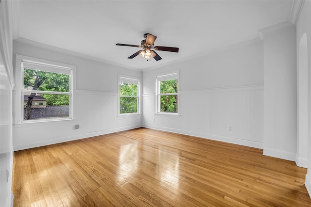 2539 Addison Rd, Houston, TX 77030 - spare room with light wood finished floors, ceiling fan, and ornamental molding