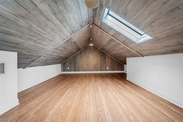 2539 Addison Rd, Houston, TX 77030 - bonus room featuring a skylight, wooden ceiling, vaulted ceiling, and wood finished floors