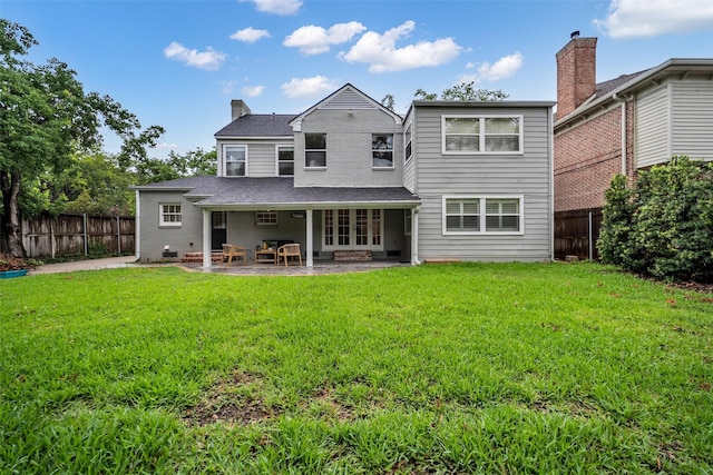 2539 Addison Rd, Houston, TX 77030 - rear view of house featuring french doors, a fenced backyard, a patio area, and a shingled roof