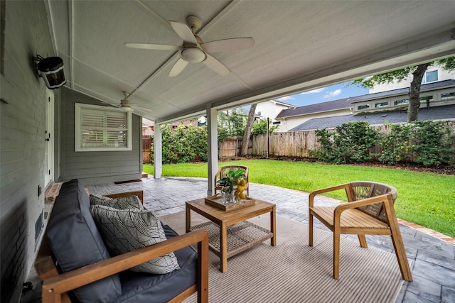 2539 Addison Rd, Houston, TX 77030 - fenced backyard featuring a ceiling fan, a patio area, and outdoor lounge area