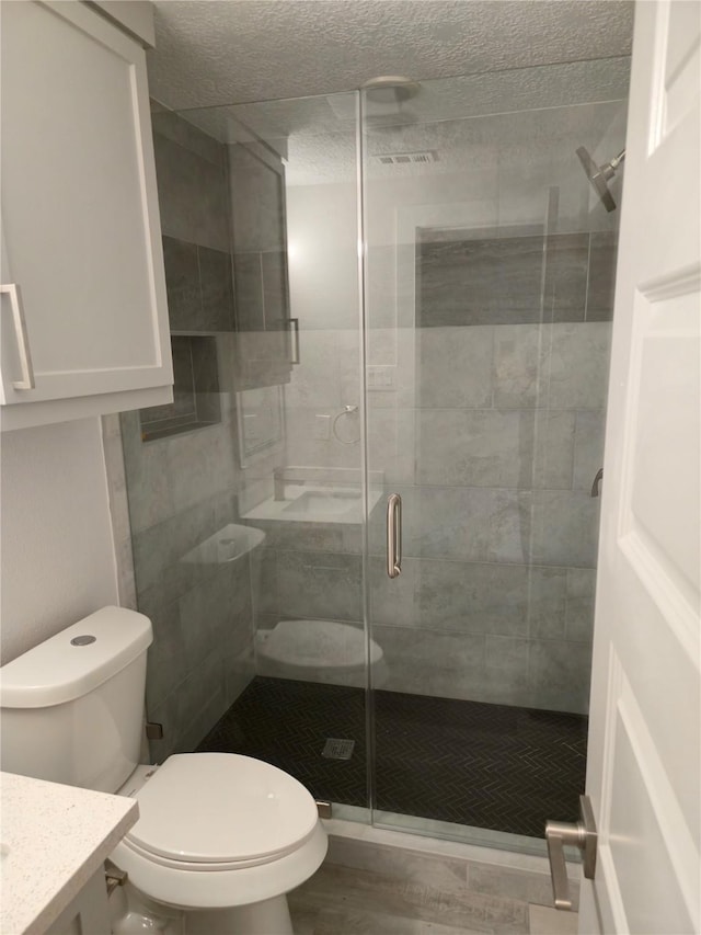 4104 Idaho St, Houston, TX 77021 - bathroom featuring vanity, a stall shower, and a textured ceiling