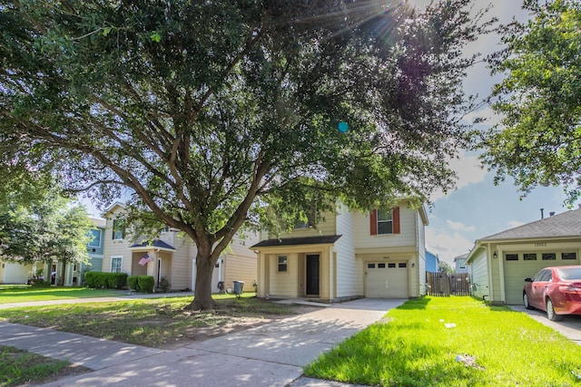 12026 Madison Oak St, Houston, TX 77038 - view of front of home featuring an attached garage and driveway