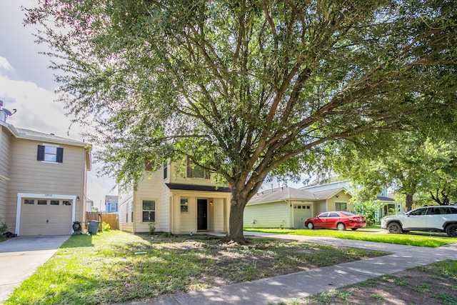 12026 Madison Oak St, Houston, TX 77038 - view of front of property with a garage and driveway
