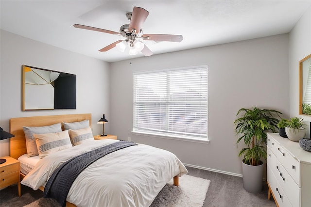 12026 Madison Oak St, Houston, TX 77038 - carpeted bedroom with baseboards and a ceiling fan