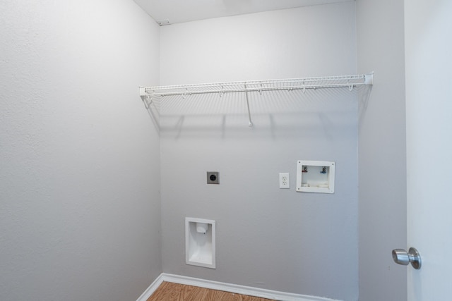 12026 Madison Oak St, Houston, TX 77038 - washroom featuring electric dryer hookup, hookup for a washing machine, and wood finished floors