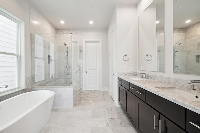 11057 Chatterton Dr, Houston, TX 77043 - full bathroom with a shower stall, a freestanding bath, double vanity, recessed lighting, and marble finish flooring