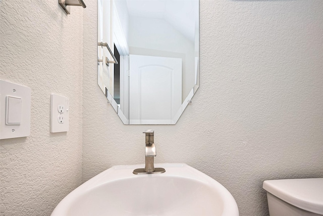 3414 Signor Dr, Houston, TX 77025 - bathroom with vaulted ceiling and a textured wall