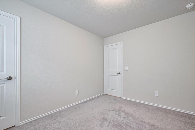 3414 Signor Dr, Houston, TX 77025 - carpeted empty room with a smoke detector and baseboards