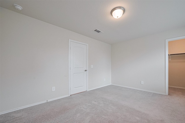 3414 Signor Dr, Houston, TX 77025 - unfurnished bedroom with a walk in closet, carpet flooring, and a closet