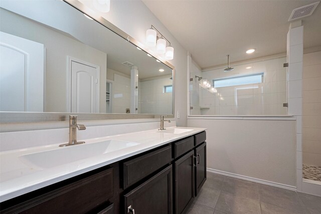 3414 Signor Dr, Houston, TX 77025 - bathroom with double vanity, walk in shower, tile patterned flooring, and recessed lighting