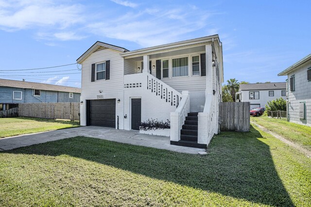 2315 67th St, Galveston, TX 77551 - view of front of home with stairway, an attached garage, and concrete driveway