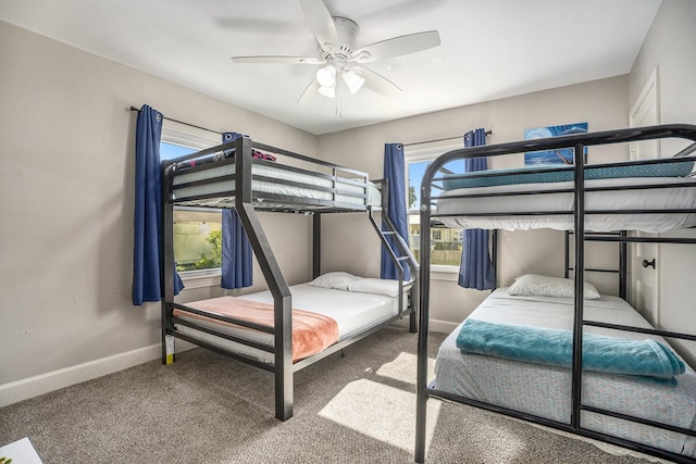2315 67th St, Galveston, TX 77551 - bedroom with carpet flooring, multiple windows, and ceiling fan