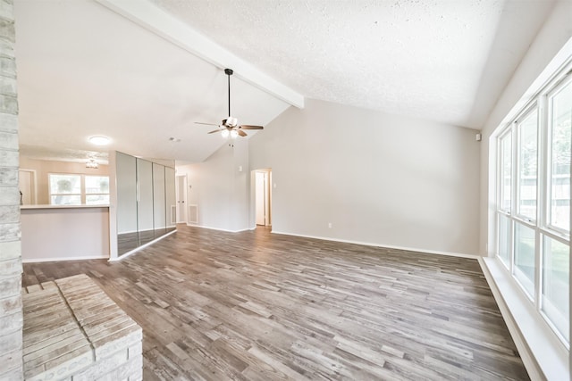 15806 Pfeiffer Dr, Houston, TX 77082 - unfurnished living room featuring beam ceiling, wood finished floors, a ceiling fan, high vaulted ceiling, and a textured ceiling