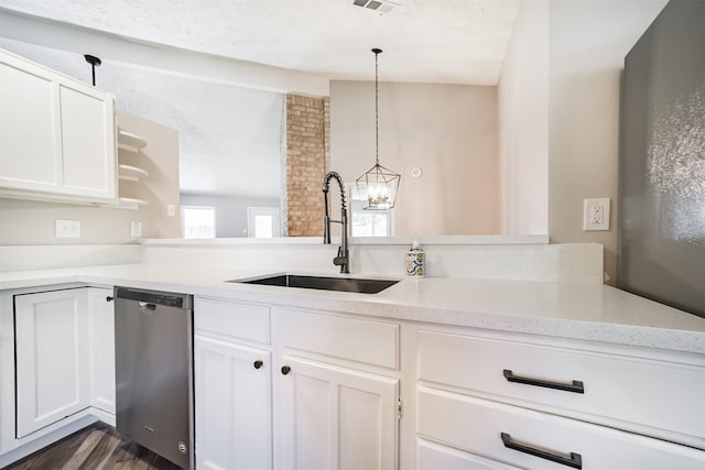 15806 Pfeiffer Dr, Houston, TX 77082 - kitchen featuring dishwasher, a chandelier, white cabinetry, dark wood-style floors, and open shelves