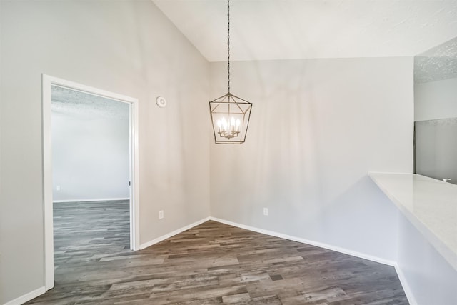 15806 Pfeiffer Dr, Houston, TX 77082 - unfurnished dining area with wood finished floors, a chandelier, and lofted ceiling