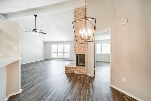 15806 Pfeiffer Dr, Houston, TX 77082 - unfurnished living room with ceiling fan, plenty of natural light, dark wood-style flooring, beamed ceiling, and a chandelier