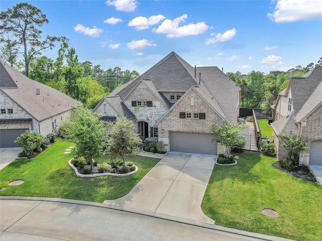 33 Violet Sunset Ln, Tomball, TX 77375 - french country inspired facade with stone siding, driveway, a garage, and roof with shingles