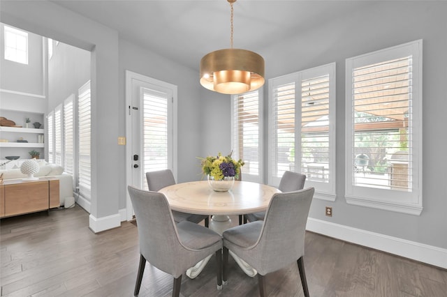 33 Violet Sunset Ln, Tomball, TX 77375 - dining room featuring wood finished floors and plenty of natural light