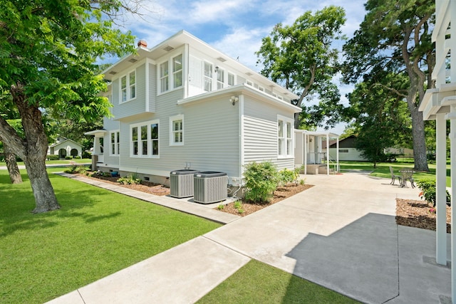 603 Hardeman St, Sealy, TX 77474 - view of property exterior featuring a chimney, a yard, and crawl space