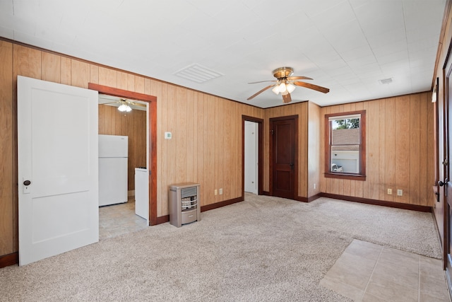603 Hardeman St, Sealy, TX 77474 - carpeted empty room featuring ceiling fan and wood walls