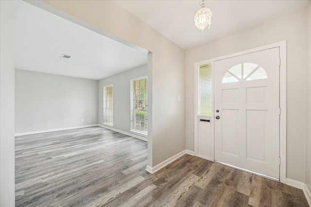 8210 Morley St, Houston, TX 77061 - entryway with wood finished floors and a chandelier