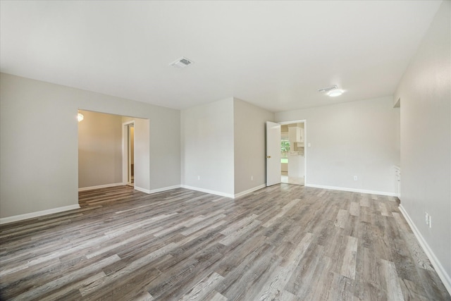 8210 Morley St, Houston, TX 77061 - unfurnished room featuring wood finished floors and baseboards