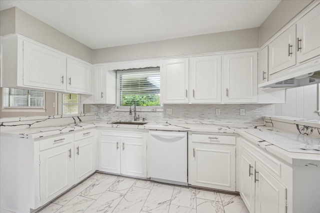 8210 Morley St, Houston, TX 77061 - kitchen with white dishwasher, light marble finish flooring, under cabinet range hood, and white cabinetry