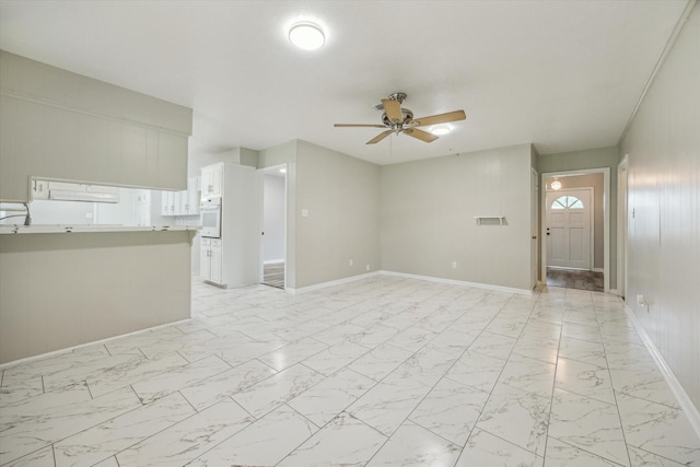 8210 Morley St, Houston, TX 77061 - unfurnished living room with ceiling fan and light marble finish floors