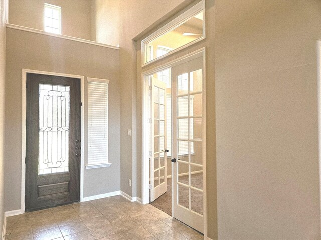 3811 Pearl Pass Ln, Sugar Land, TX 77479 - foyer entrance featuring french doors, tile patterned floors, and healthy amount of natural light