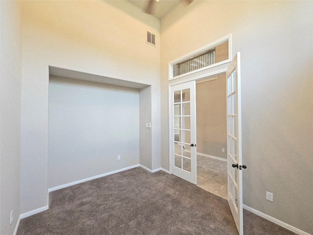 3811 Pearl Pass Ln, Sugar Land, TX 77479 - unfurnished room featuring french doors, carpet floors, and a high ceiling
