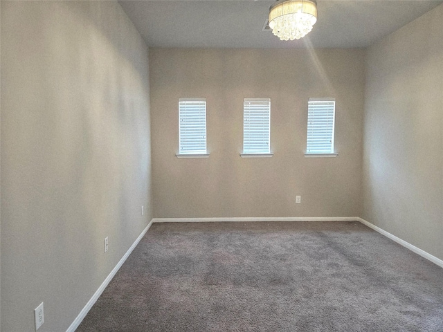 3811 Pearl Pass Ln, Sugar Land, TX 77479 - unfurnished room with carpet floors, plenty of natural light, and a chandelier