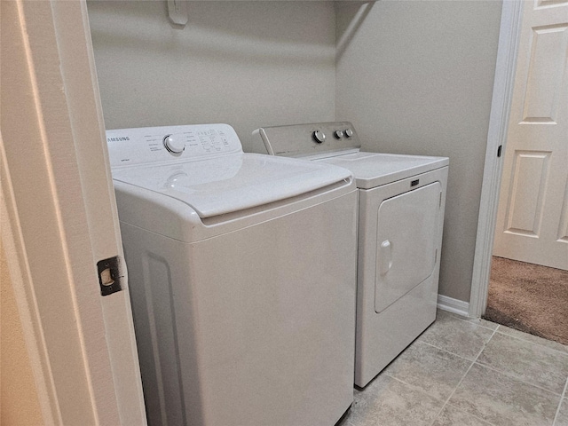 3811 Pearl Pass Ln, Sugar Land, TX 77479 - laundry room with washing machine and dryer and light tile patterned flooring