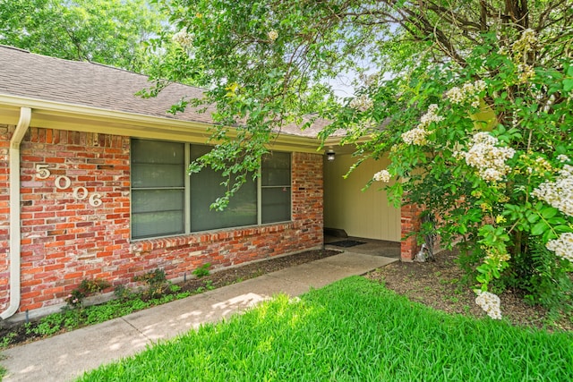 5006 Hazelton St, Houston, TX 77035 - entrance to property featuring brick siding and roof with shingles