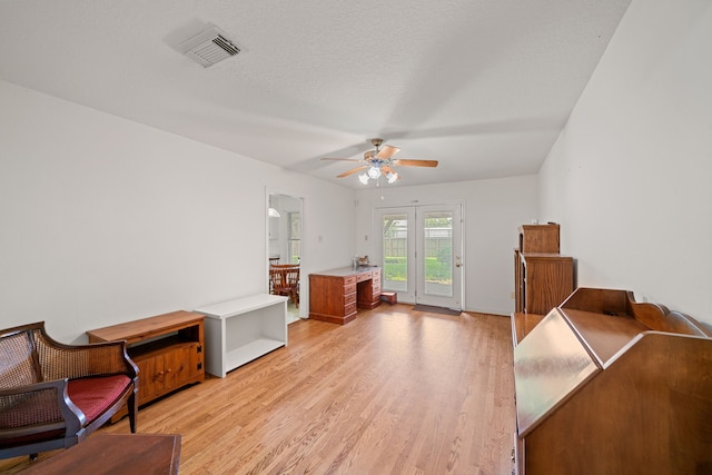 5006 Hazelton St, Houston, TX 77035 - living area with light wood-style floors and ceiling fan