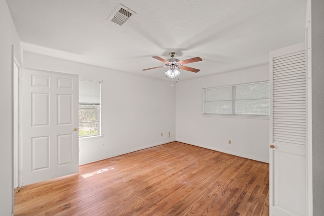 5006 Hazelton St, Houston, TX 77035 - unfurnished bedroom with light wood-style flooring and ceiling fan