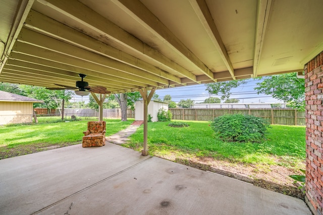 5006 Hazelton St, Houston, TX 77035 - fenced backyard featuring a patio, a shed, and ceiling fan