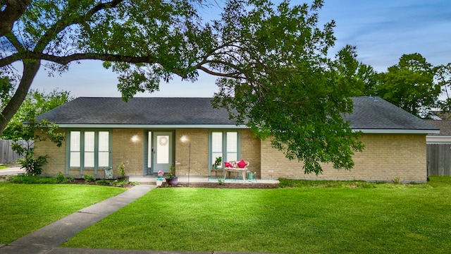 11614 Brighton Ln, Meadows Place, TX 77477 - view of front of property with brick siding and a shingled roof