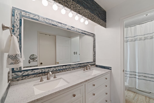 11614 Brighton Ln, Meadows Place, TX 77477 - bathroom with double vanity and a shower with curtain