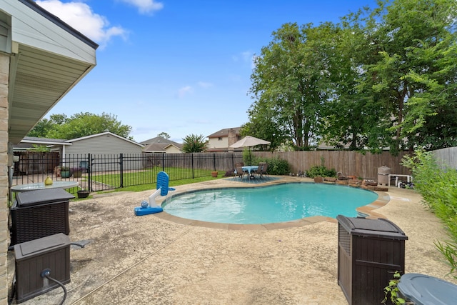 11614 Brighton Ln, Meadows Place, TX 77477 - view of pool featuring a patio area and a fenced backyard