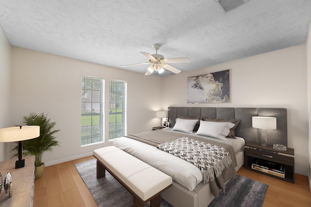 11614 Brighton Ln, Meadows Place, TX 77477 - bedroom with wood finished floors, a textured ceiling, and ceiling fan