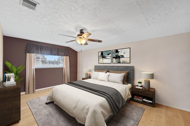 11614 Brighton Ln, Meadows Place, TX 77477 - bedroom with a textured ceiling, light wood-type flooring, and a ceiling fan