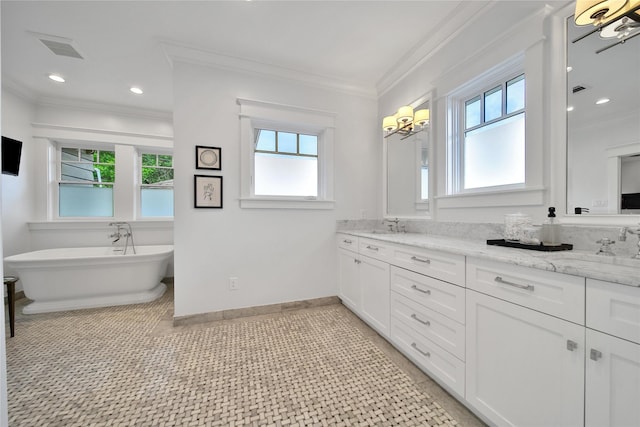 811 Byrne St, Houston, TX 77009 - bathroom featuring plenty of natural light, double vanity, a soaking tub, crown molding, and recessed lighting