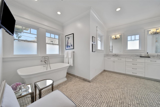811 Byrne St, Houston, TX 77009 - full bathroom featuring healthy amount of natural light, a freestanding tub, double vanity, ornamental molding, and recessed lighting