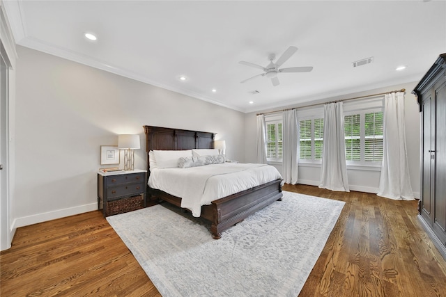 811 Byrne St, Houston, TX 77009 - bedroom featuring ornamental molding, dark wood-style flooring, recessed lighting, and a ceiling fan
