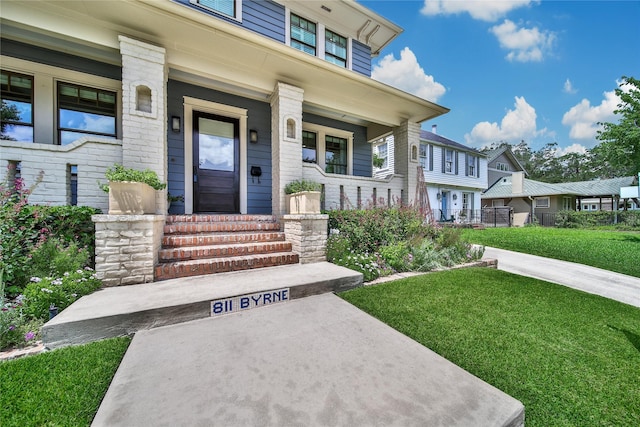 811 Byrne St, Houston, TX 77009 - property entrance with a porch and a yard