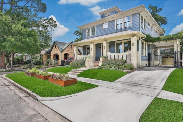 811 Byrne St, Houston, TX 77009 - traditional style home with concrete driveway, a gate, a front yard, and covered porch