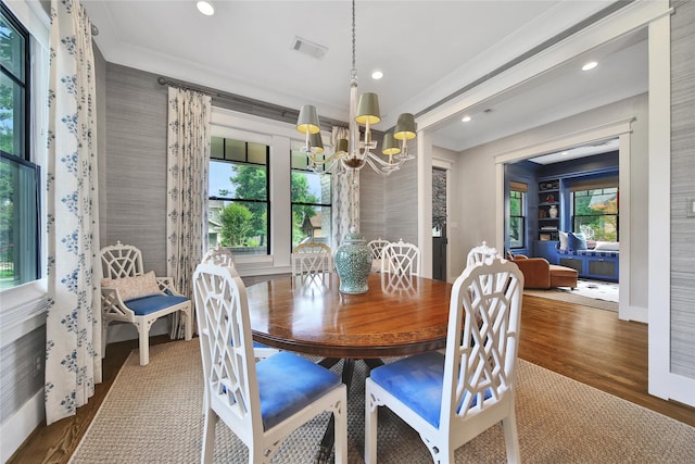 811 Byrne St, Houston, TX 77009 - dining room with a chandelier, ornamental molding, plenty of natural light, wood finished floors, and recessed lighting