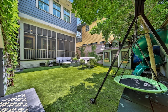 811 Byrne St, Houston, TX 77009 - view of grassy yard featuring an outdoor hangout area, a playground, a trampoline, a sunroom, and an outbuilding