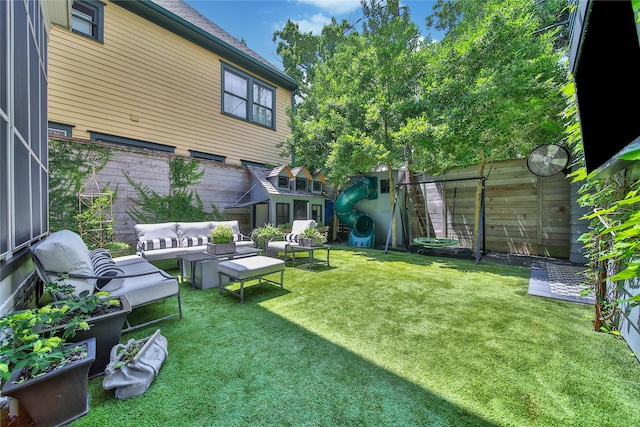 811 Byrne St, Houston, TX 77009 - fenced backyard featuring outdoor lounge area and a playground