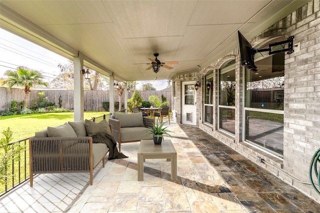 7611 Highmeadow Dr, Houston, TX 77063 - fenced backyard featuring a ceiling fan, a patio, outdoor dining area, and an outdoor hangout area